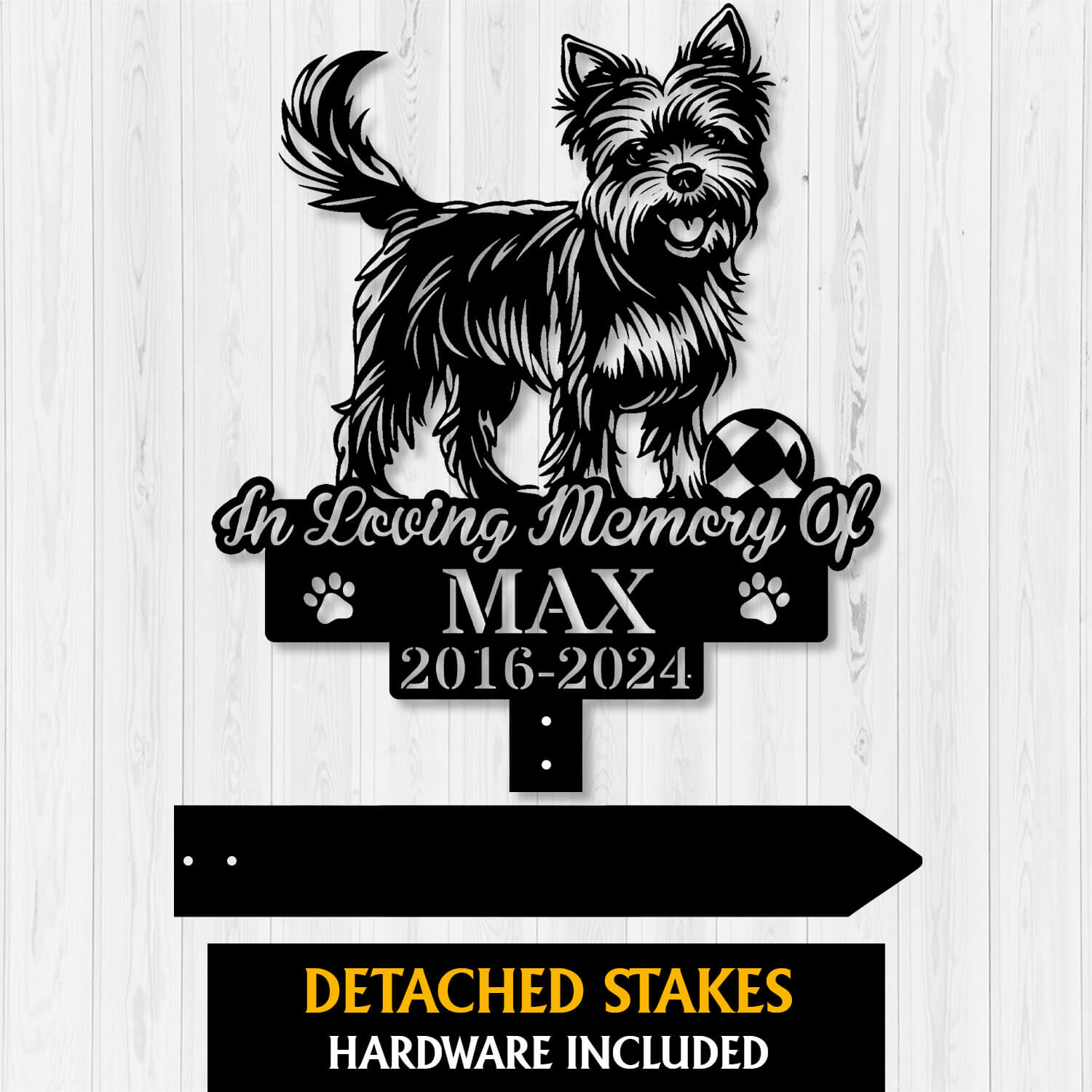 Close-up of engraved Yorkshire Terrier grave marker with paw prints and playful pose