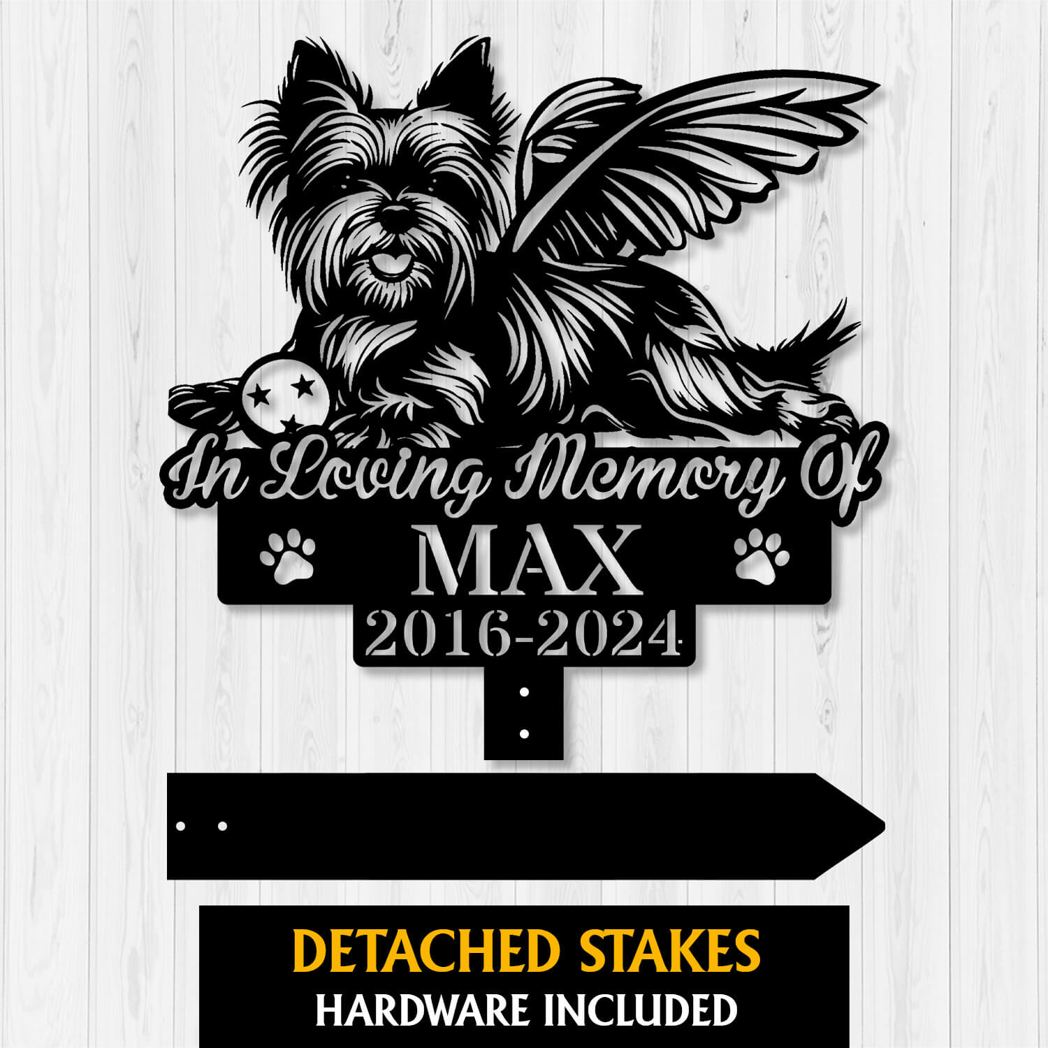 Close-up of engraved Yorkshire Terrier Angel with Ball Grave Marker in garden setting