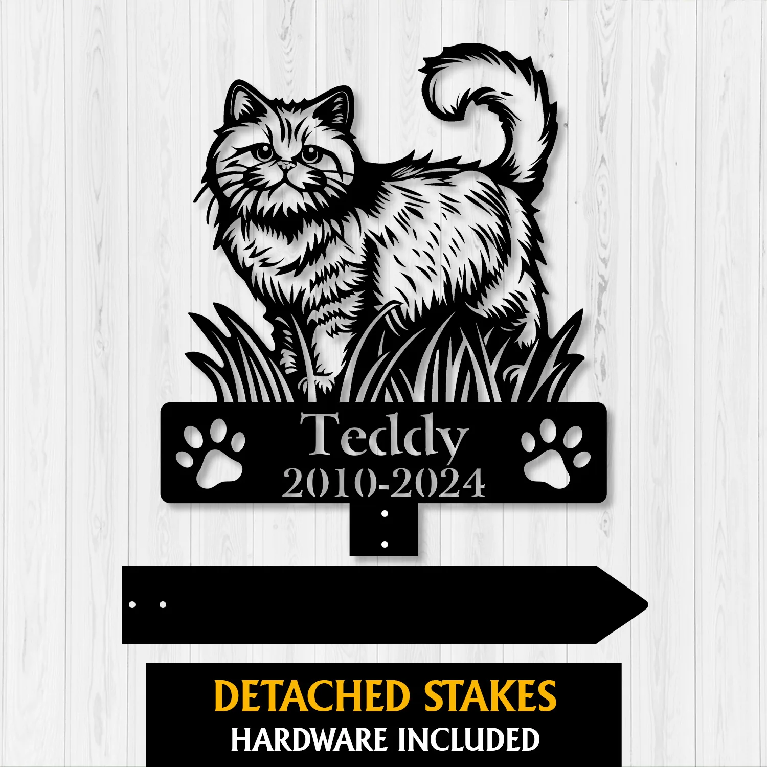 Black cat memorial metal yard stake with paw prints, text “Teddy 2010-2024,” on white wood background