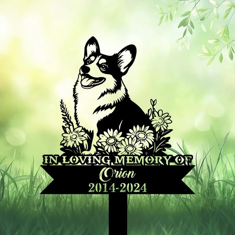 A memorial sign featuring a Corgi surrounded by flowers, with the text 'In Loving Memory of Orion 2014-2024'.