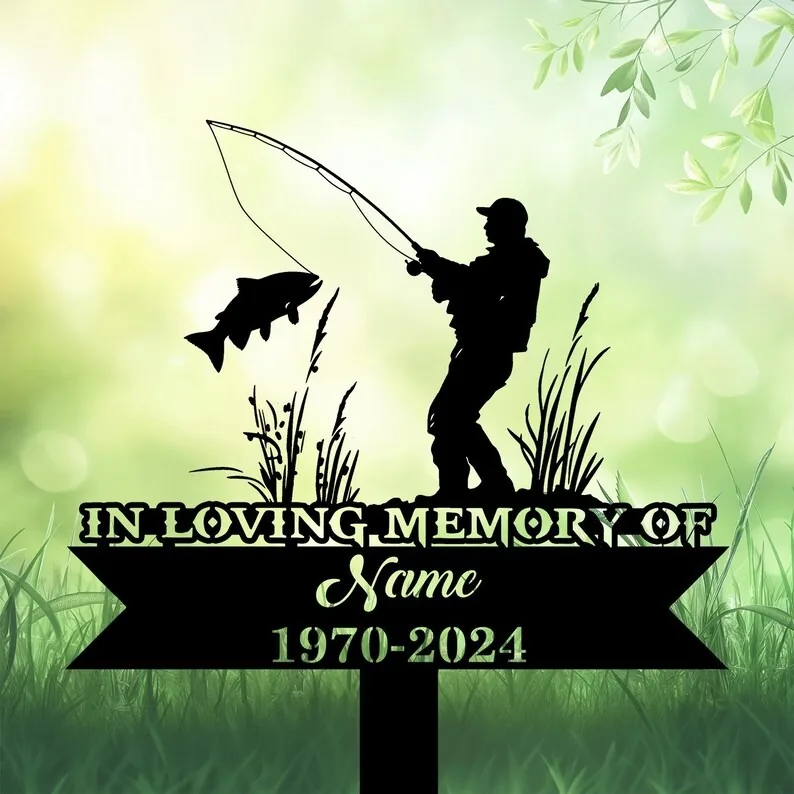 Fishing memorial garden stake silhouette with text “In Loving Memory of Name 1970-2024” on green grass background