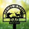 Black yard stake sign reading "Hunting in Heaven Dad 1952-2024" with hunter, deer, and pine forest silhouette.