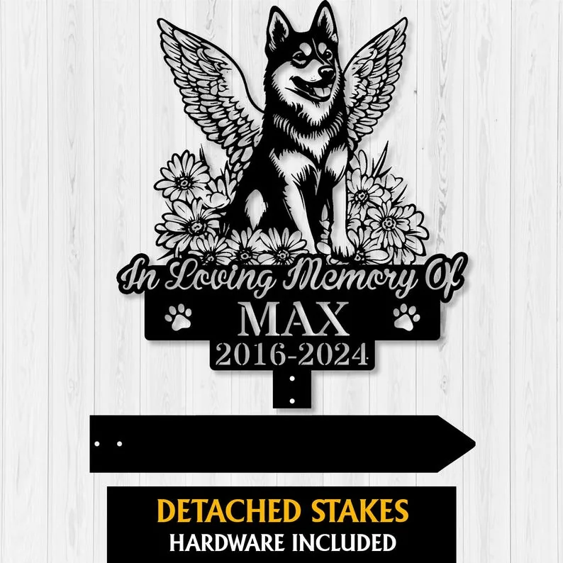 Memorial sign featuring a winged dog, flowers, and the name Max with dates 2016-2024, on a wood background.