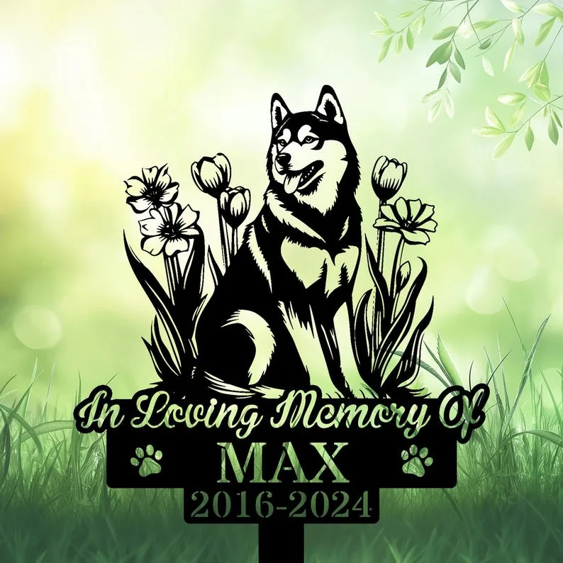 A black silhouette of a husky surrounded by flowers, with the text 'In Loving Memory Of MAX 2016-2024' on a sign.