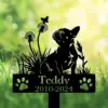 A silhouette of a dog with flowers and a butterfly, featuring a sign that reads 'Teddy 2010-2024'.