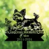 A memorial sign featuring a playful dog and butterfly, with text 'In Loving Memory of Orion 2014-2024'.