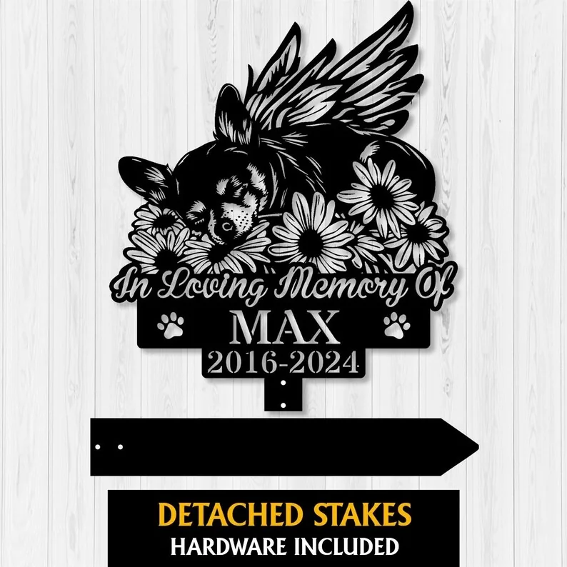 A black memorial sign featuring a sleeping dog surrounded by flowers, reading 'In Loving Memory Of MAX 2016-2024'.