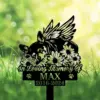 A memorial sign featuring a sleeping dog with wings, surrounded by flowers, with the text 'In Loving Memory Of MAX 2016-2024'.