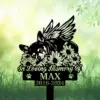 A decorative memorial sign featuring a sleeping dog with wings surrounded by flowers, reading 'In Loving Memory Of MAX 2016-2024'.