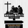 Metal memorial sign featuring a motorcycle and a cross, customizable with name and dates, with detached stakes included.