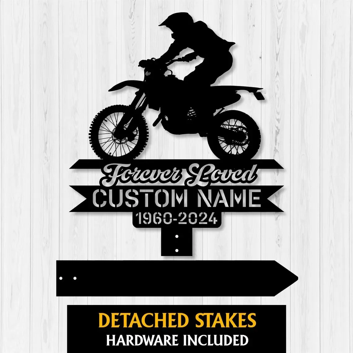 Black motocross memorial yard sign with rider silhouette, “Forever Loved Custom Name 1960-2024,” on white wood wall