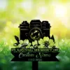 Black silhouette memorial sign with a camera and flowers reading "In Loving Memory" and placeholder "Custom Name 1982-2026" against a sunlit grassy background