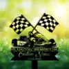 10-2 Black silhouette of a race car with crossed checkered flags and text reading "In Loving Memory of Custom Name 1982-2026" over a sunlit grassy background