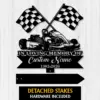 10a-2 Black metal memorial sign with crossed checkered racing flags and a go-kart illustration, text reading "In Loving Memory of Custom Name 1982-2026" against a light wood background