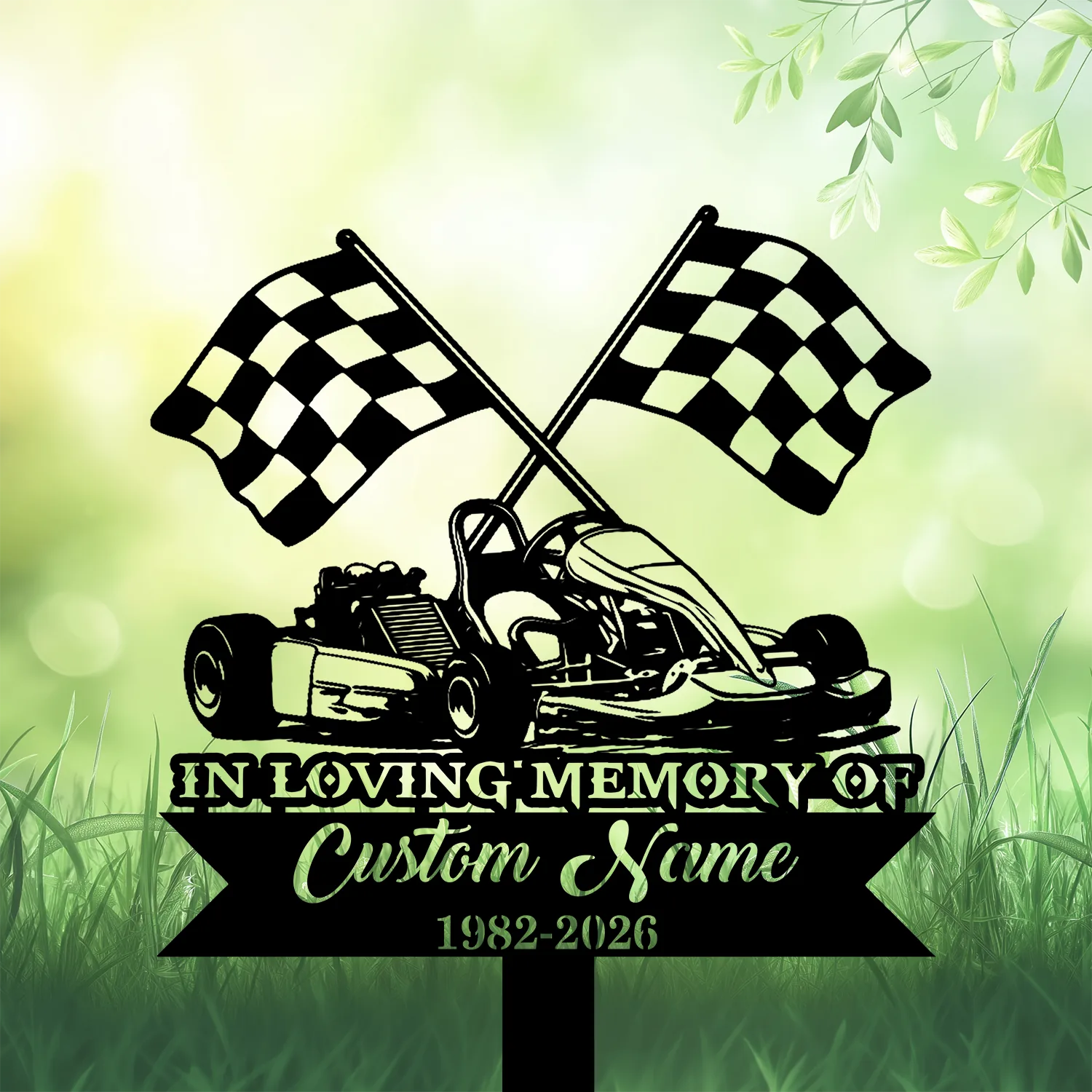 10b-2 Black silhouette memorial sign showing a go-kart with crossed checkered flags and banner reading "In Loving Memory" with customizable name and dates against a soft green grass background