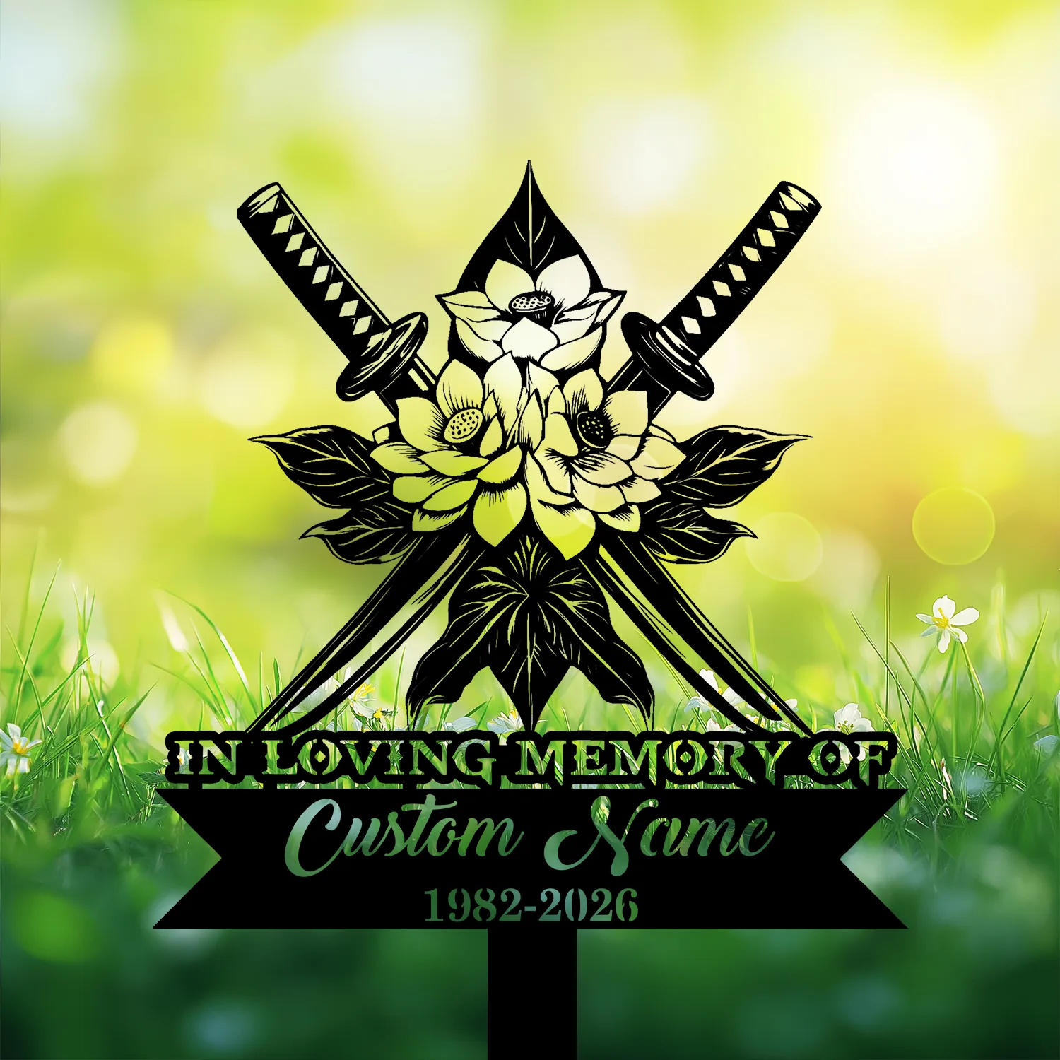 Black memorial sign with crossed katanas and floral motif reading “IN LOVING MEMORY OF” and placeholder “Custom Name 1982-2026” against sunny grassy background