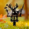 Black metal yard memorial sign with deer, hunting bow and rifle above the word DAD and dates 1932 - 2025 placed in grassy yard