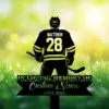 14 Silhouette of a hockey player wearing jersey name "MATTHEW" and number 28 standing over grassy field with daisies and memorial text banner reading "In Loving Memory" and dates 1982-2026