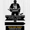 14a Black silhouette hockey player from behind wearing jersey 'MATTHEW' and number 28 above ribbon reading 'In Loving Memory of Custom Name 1982-2026' on a light wood background