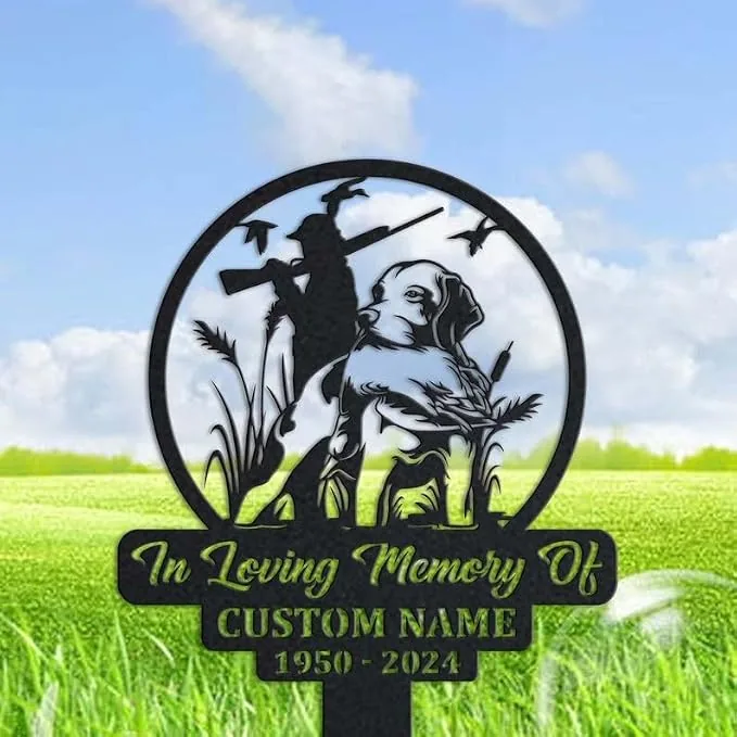 Metal memorial yard sign showing a hunting dog and hunter silhouette with birds, text reading "In Loving Memory Of CUSTOM NAME 1950 - 2024" against a grassy field
