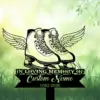 Illustration of winged ice skates above a black memorial banner reading "In Loving Memory" with placeholder "Custom Name" and dates 1982-2026 on a green grassy, leafy background