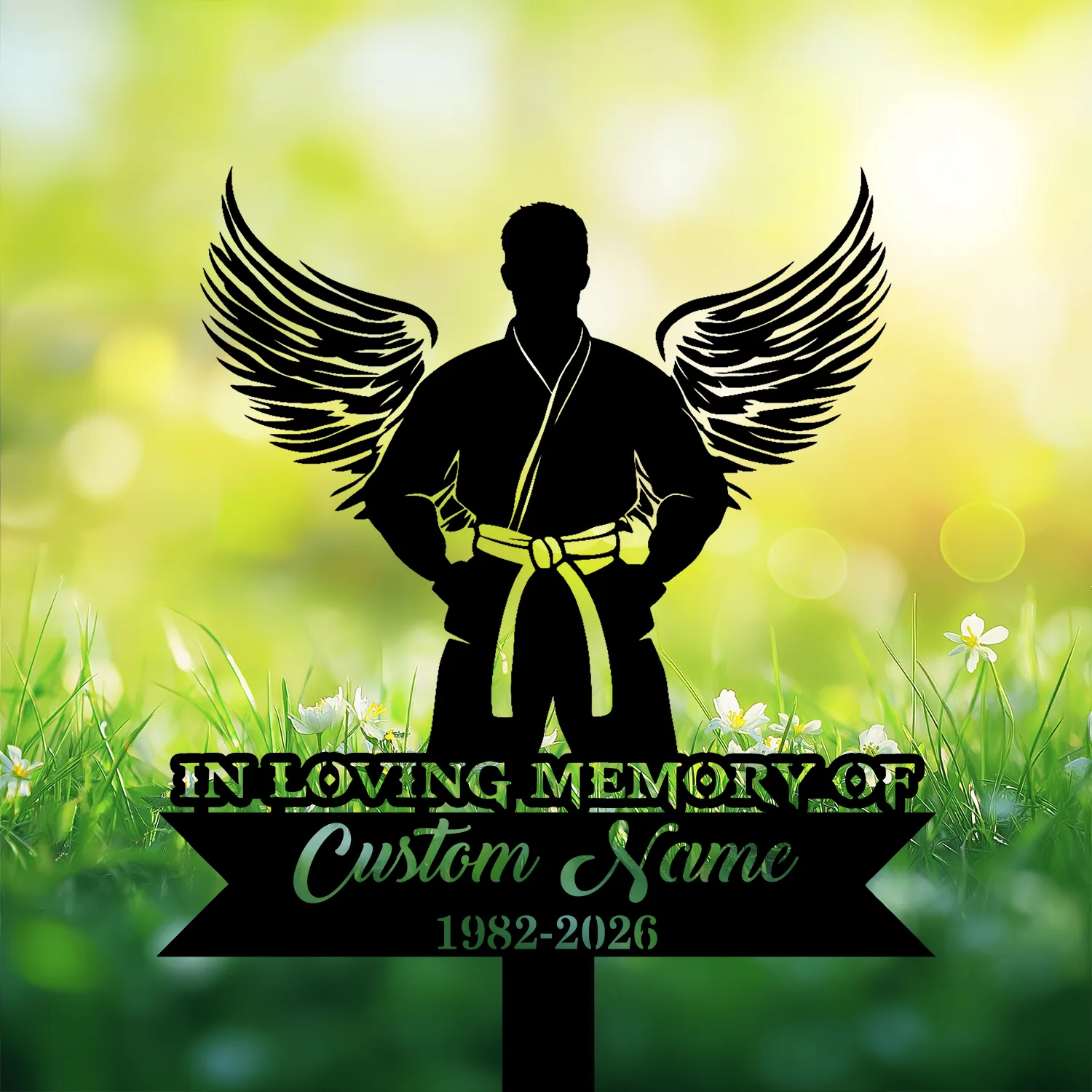 Black silhouette of a martial artist with wings and a yellow belt on a floral green bokeh background, memorial text reading "IN LOVING MEMORY OF" and placeholder "Custom Name 1982-2026"