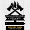 Black metal memorial sign with crossed axes and pine trees, text reading "IN LOVING MEMORY OF" and placeholder "Custom Name 1982-2026" on a white wood background