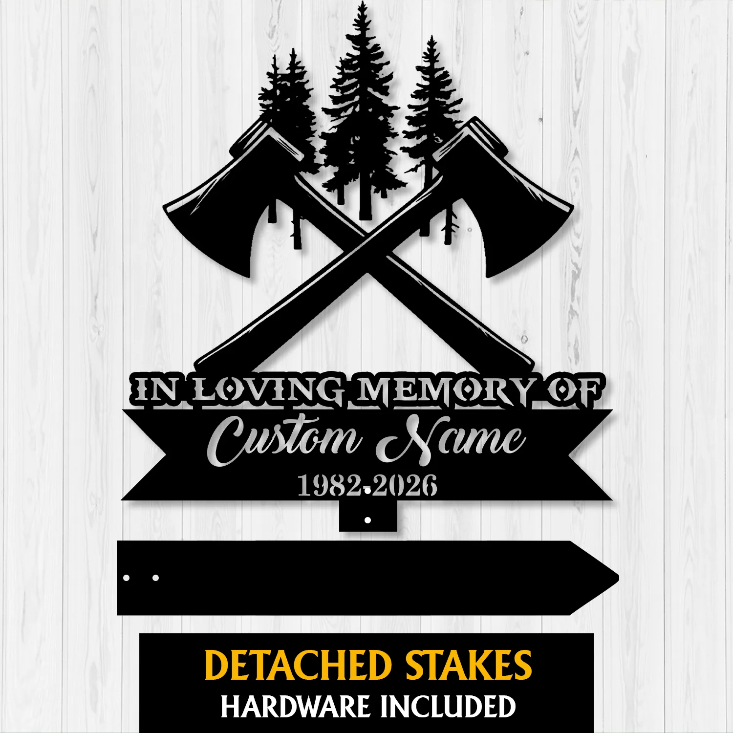 Black metal memorial sign with crossed axes and pine trees, text reading "IN LOVING MEMORY OF" and placeholder "Custom Name 1982-2026" on a white wood background