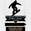 Black silhouette of a snowboarder above a memorial sign reading "In Loving Memory of Custom Name 1986-2026" on a white wood background