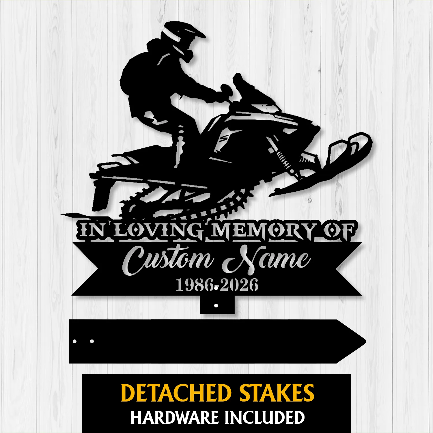 Black metal memorial sign silhouette of a person riding a snowmobile above text reading "In Loving Memory of Custom Name 1986-2026" on a white wood background