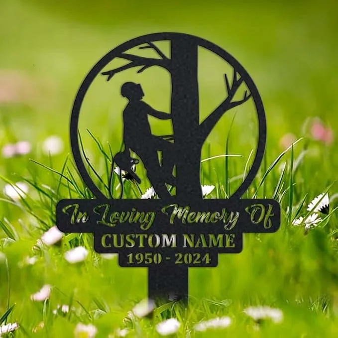 191 Black metal memorial garden sign in grass showing a silhouette of a person climbing a tree, reads "In Loving Memory Of", placeholder "CUSTOM NAME" and dates "1950 - 2024"
