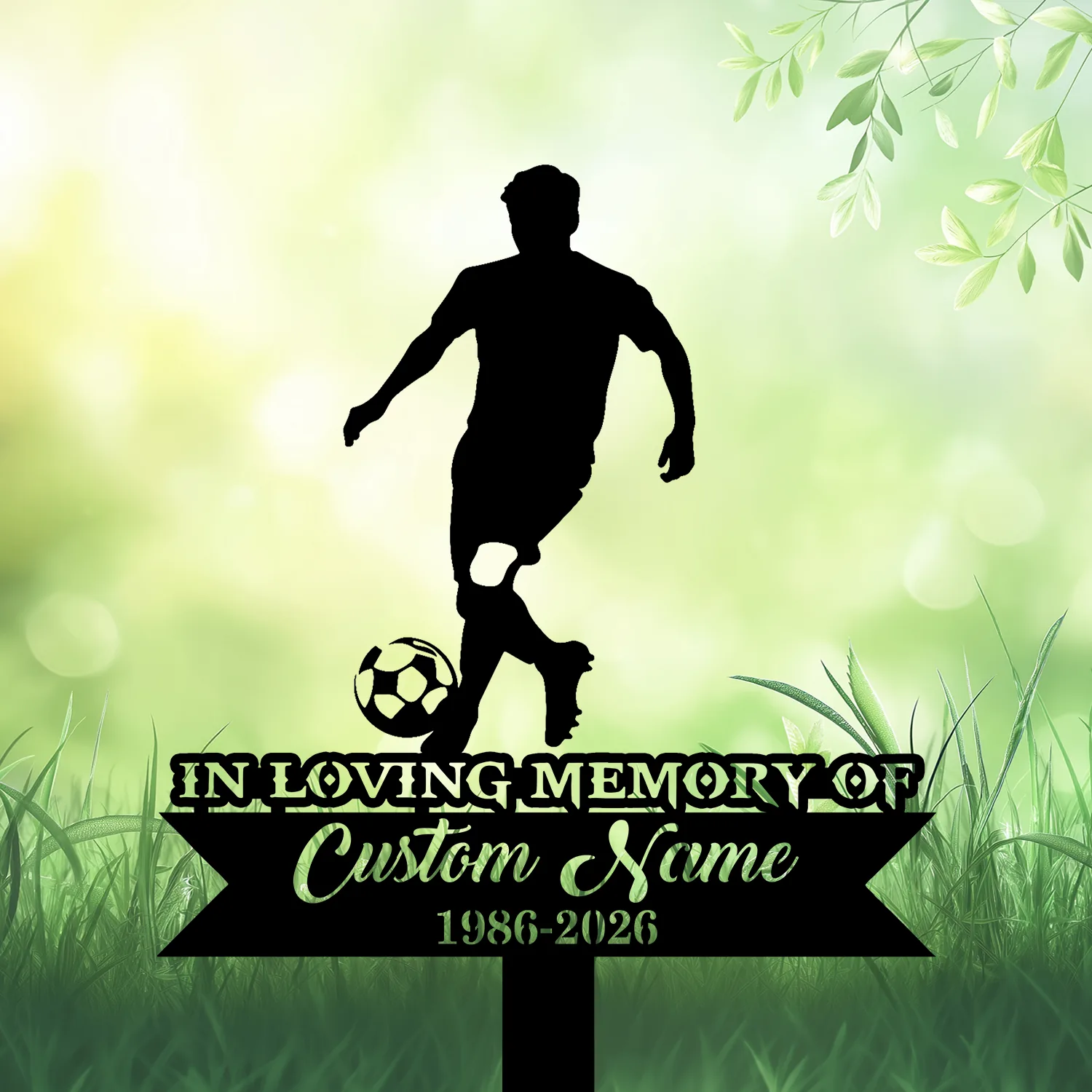 Black silhouette of a soccer player dribbling a ball above grave sign reading "In Loving Memory" and customizable name and dates against a soft green leafy background