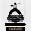 Black silhouette metal memorial sign of a kneeling samurai with katana above text 'In Loving Memory Of Custom Name 1987-2026' on a white wood plank background
