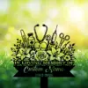 Black memorial garden sign with flowers and medical icons (stethoscope, syringe, vial, thermometers) reading "IN LOVING MEMORY" and placeholder "Custom Name 1982-2026" against a sunlit grassy background