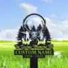 203 Black metal memorial yard sign with a deer head and pine trees silhouette reading "In Loving Memory Of" and placeholder "CUSTOM NAME 1950-2023" staked in a grassy field