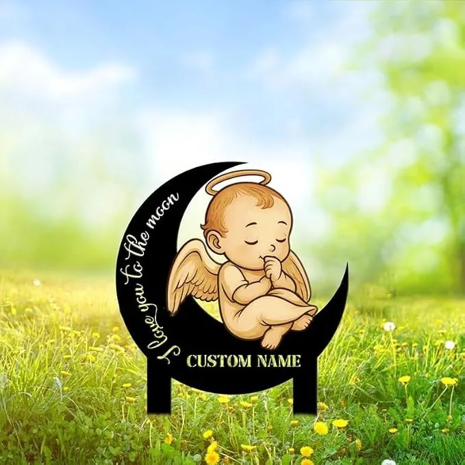 Garden stake sign showing a sleeping angel baby with halo perched on a black crescent moon over text ‘I love you to the moon’ and customizable name field