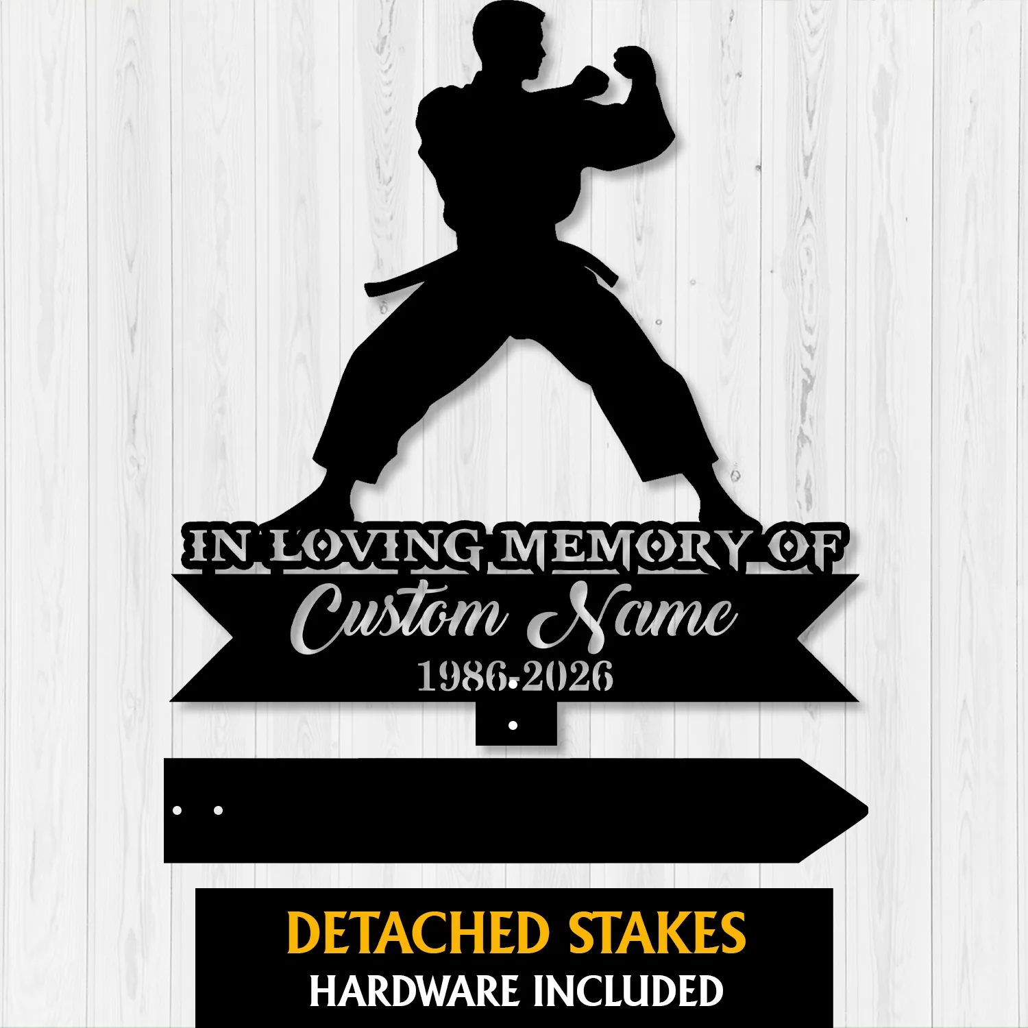 Black silhouette of a martial artist in a fighting stance above text reading "In Loving Memory Of" and placeholder "Custom Name 1986-2026" on a white wood background