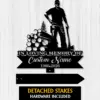 Black metal memorial sign silhouette of a logger with axe and stacked logs, banner reading "IN LOVING MEMORY OF" and placeholder "Custom Name 1986-2026" on a light wood background