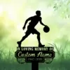 3b-1 Silhouette of a basketball player dribbling above a memorial plaque reading "In Loving Memory of Custom Name 1987-2026" set in grassy, leafy green background