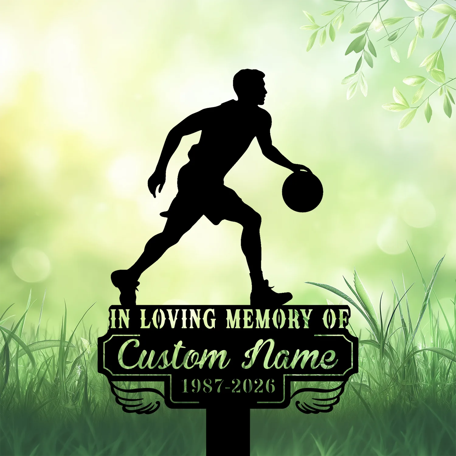 3b-1 Silhouette of a basketball player dribbling above a memorial plaque reading "In Loving Memory of Custom Name 1987-2026" set in grassy, leafy green background