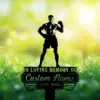 Silhouette memorial sign of a muscular boxer standing over a plaque reading "In Loving Memory of Custom Name 1987-2026" set against sunlit grass and white flowers