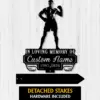 Black memorial sign silhouette of a muscular boxer above text reading "In Loving Memory of Custom Name 1987-2026" on a light wood plank background