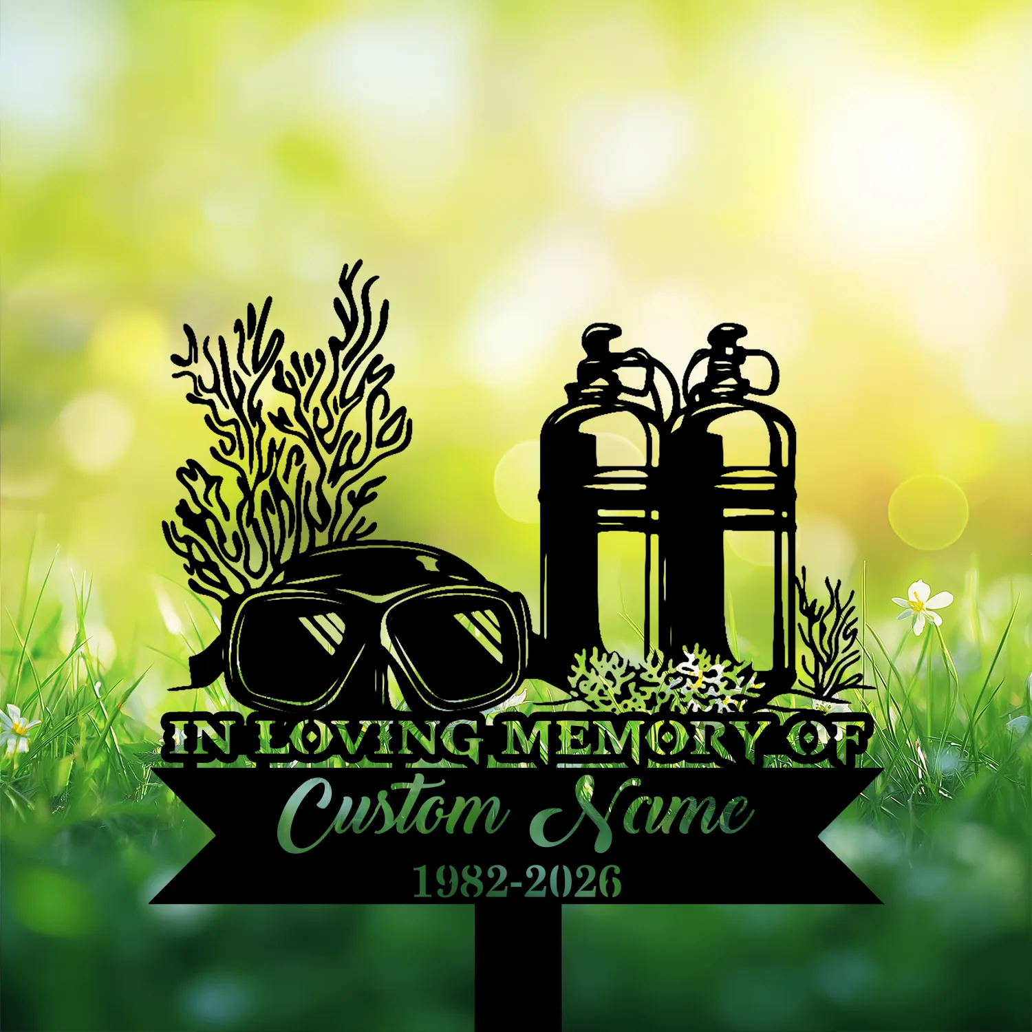 5-4 Black memorial sign silhouette with scuba tanks, diving mask, coral and sea plants reading "In Loving Memory" and placeholder "Custom Name 1982-2026" against a sunny grassy bokeh background