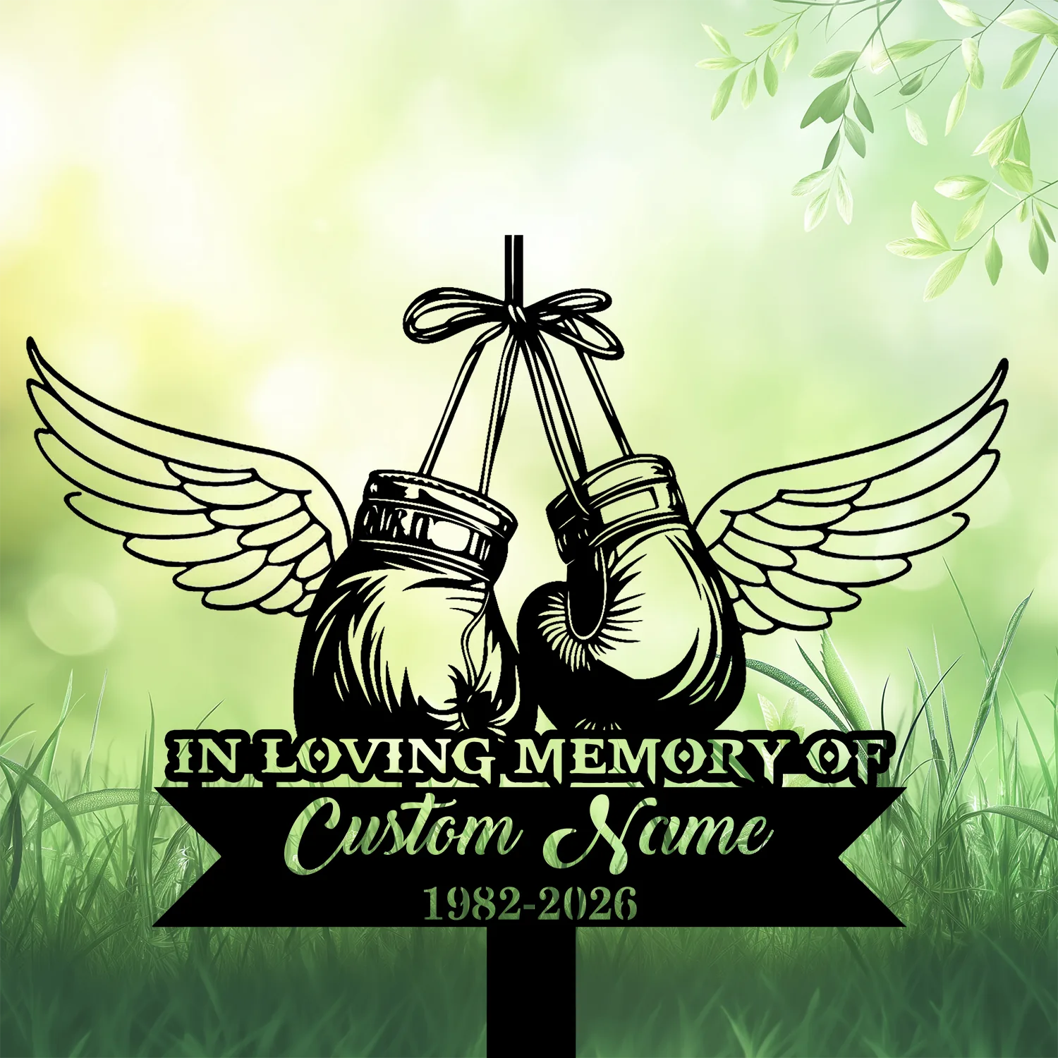 5b-3 Black vintage boxing gloves with angel wings hanging from a ribbon above grass, framed by green bokeh background and text reading "IN LOVING MEMORY" and placeholder "Custom Name 1982-2026"