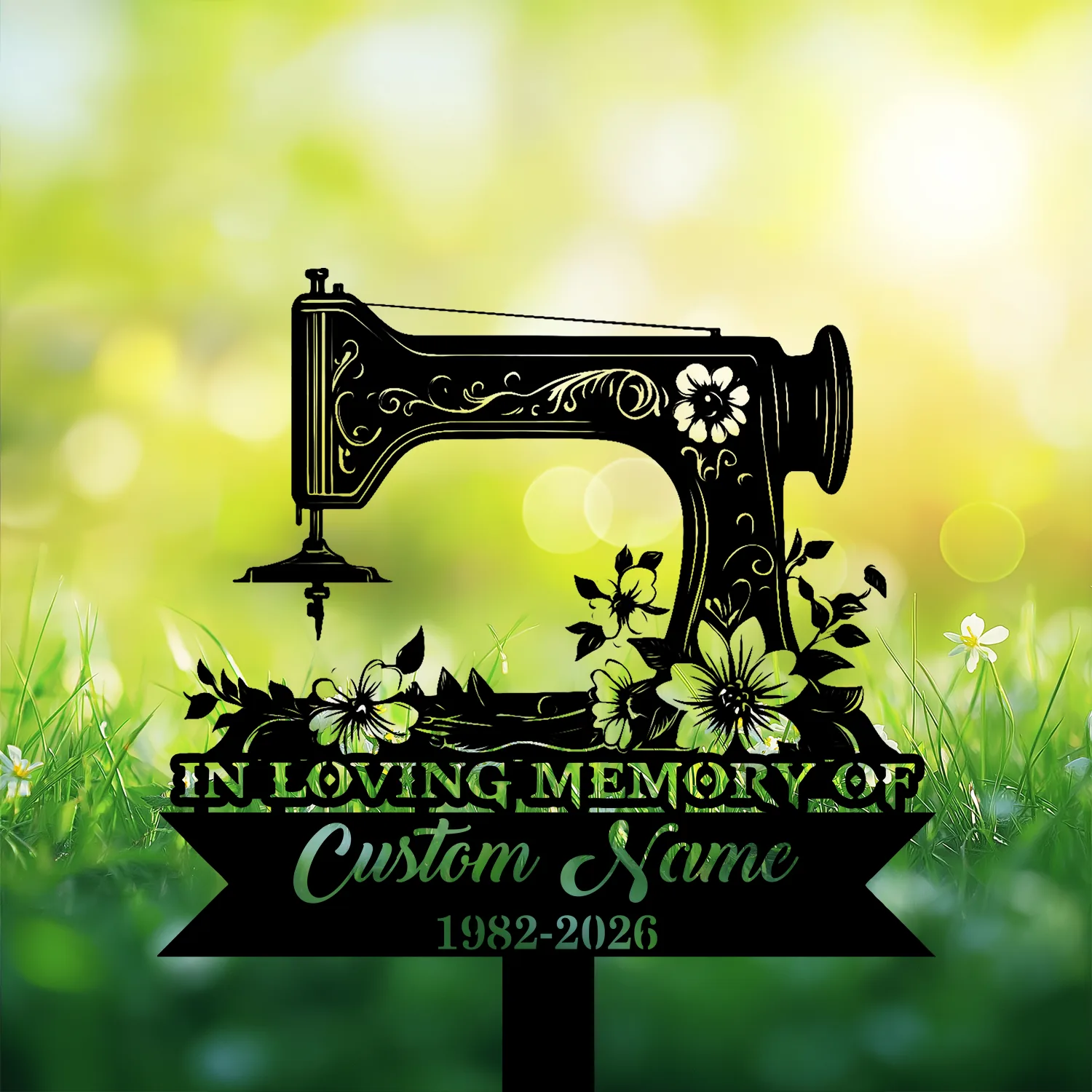 Black silhouette of a vintage sewing machine with floral accents over green grass and bokeh background, text reading "In Loving Memory of Custom Name 1982-2026"