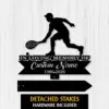Black silhouette of a tennis player with racket above a memorial sign reading "In Loving Memory of" and placeholder "Custom Name 1986-2026" on a light wood background