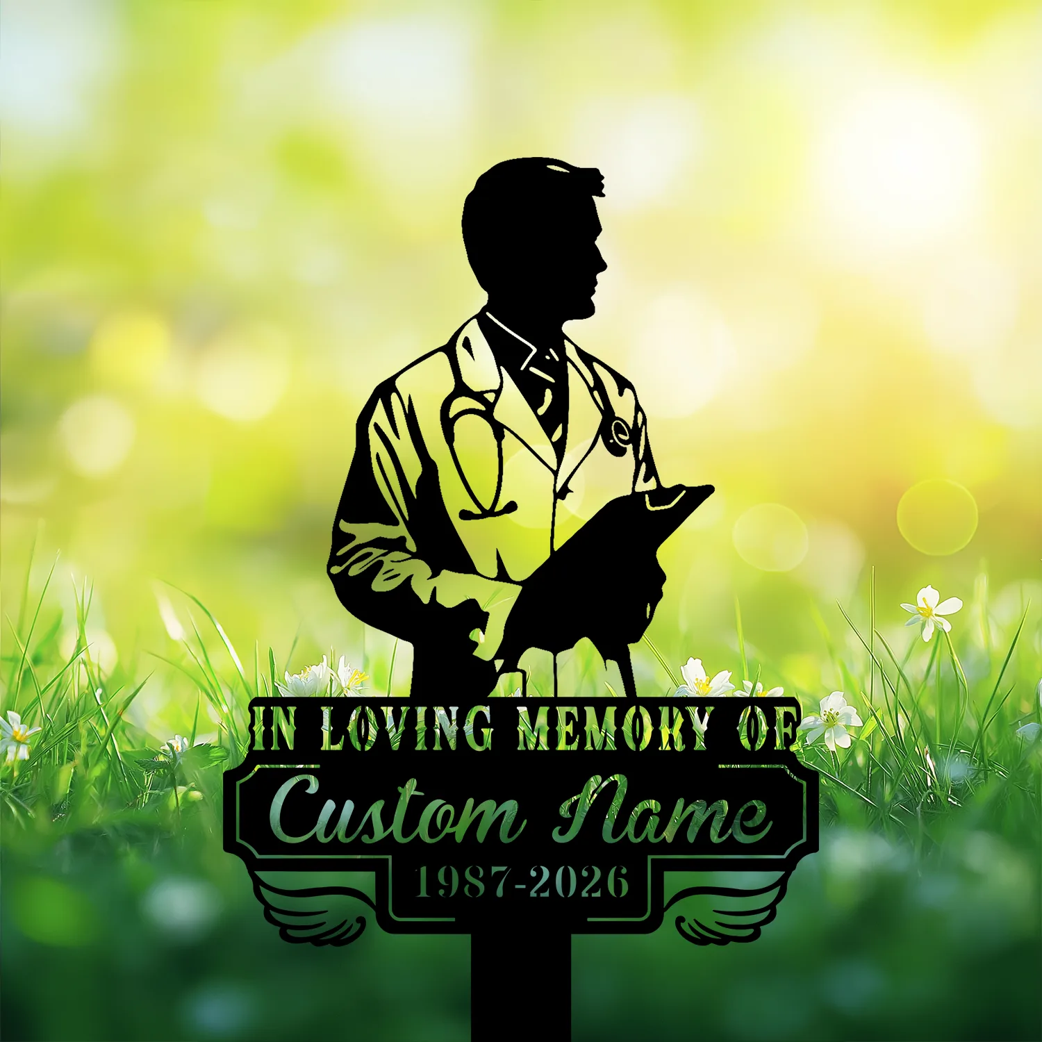 Silhouette memorial sign of a doctor with stethoscope holding a clipboard above grass and flowers, text reading "In Loving Memory of Custom Name 1987-2026"