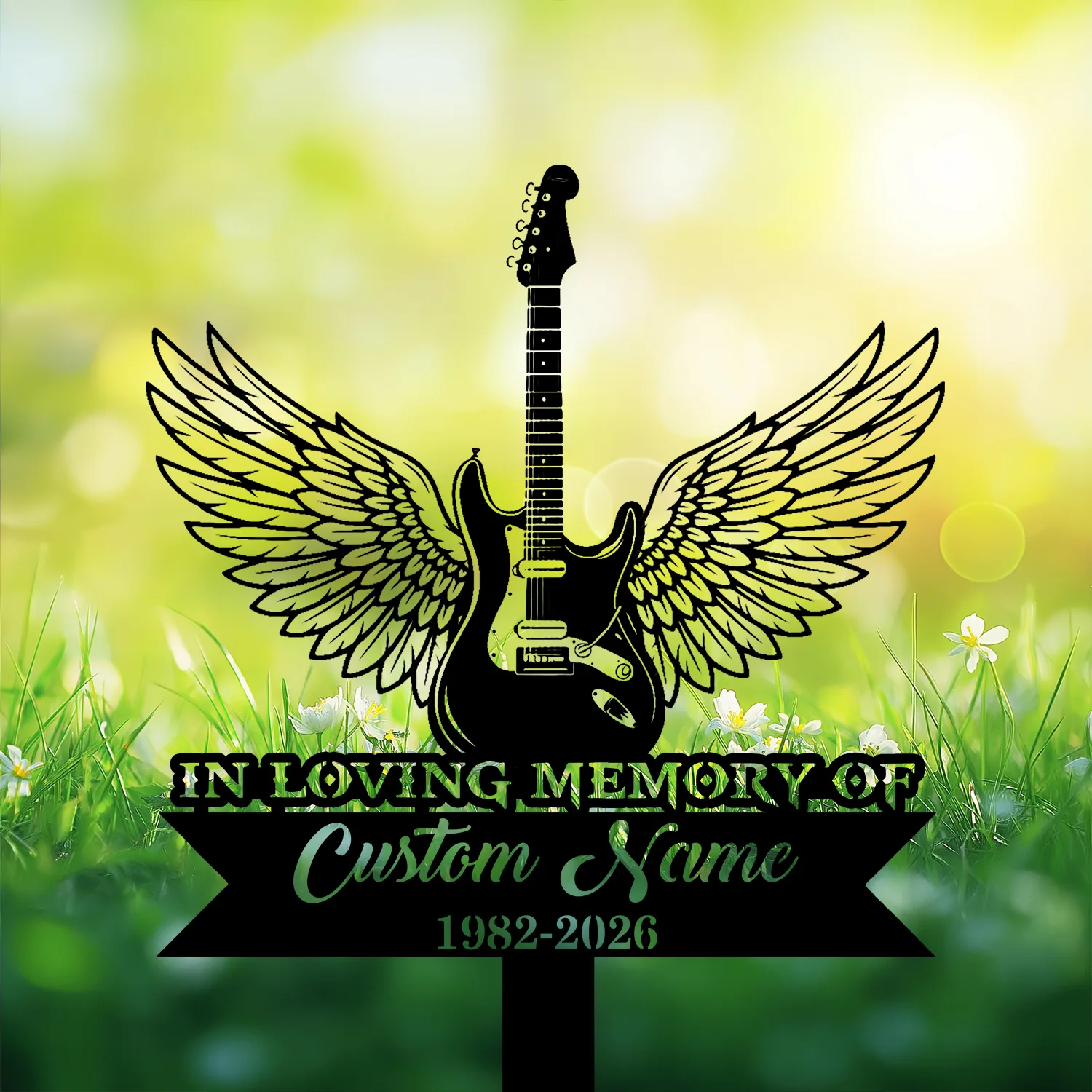 Black silhouette of an electric guitar with angel wings over a grassy background, text banner reading "In Loving Memory" and placeholder "Custom Name 1982-2026"