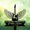 Black electric guitar with angel wings on a green bokeh background above grass, memorial sign reading "IN LOVING MEMORY", placeholder "Custom Name" and dates 1982-2026