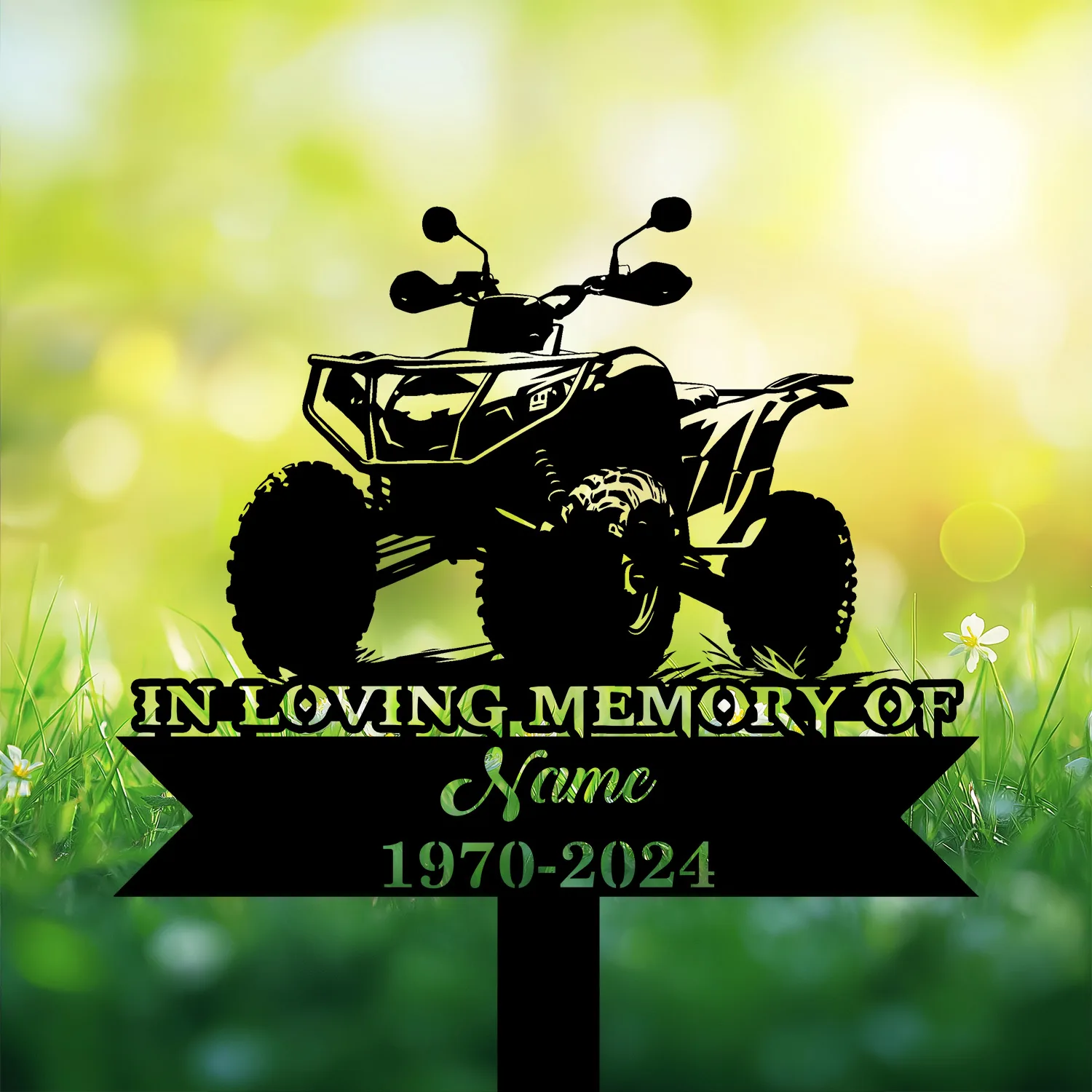 Silhouette of an ATV memorial sign reading "In Loving Memory" with placeholder name and dates 1970-2024 against a sunny green grassy background